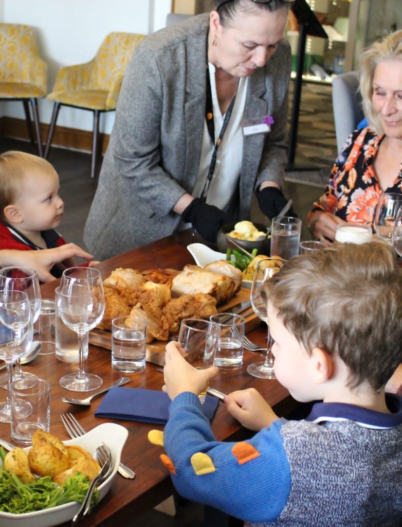 Family enjoying Sunday Lunch